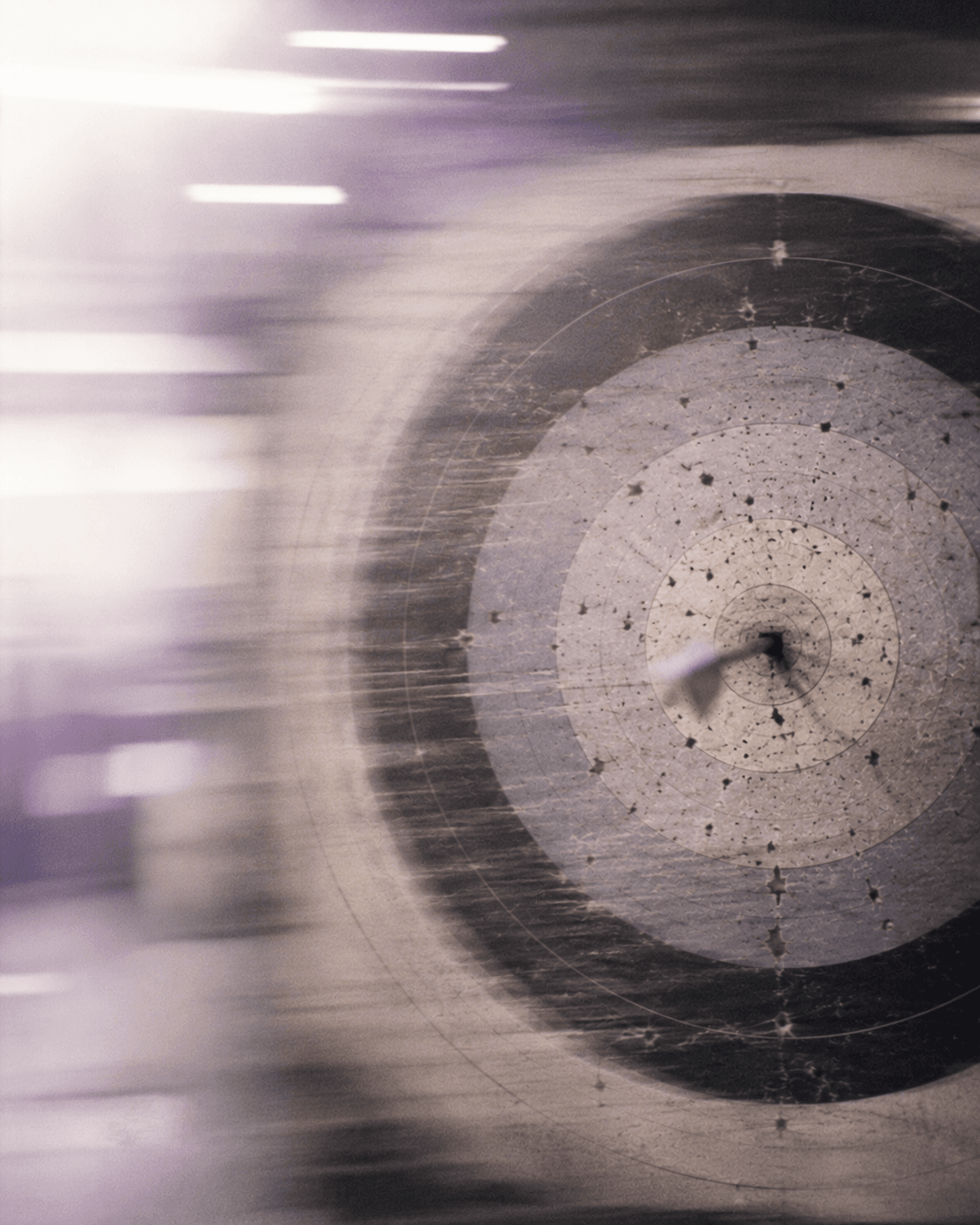An arrow in the centre of a target